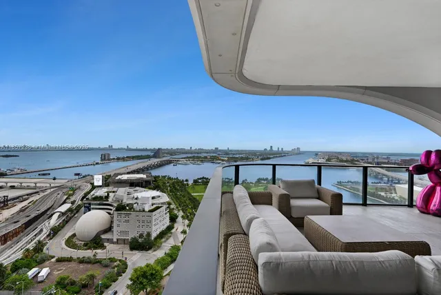 an outdoor living room with furniture