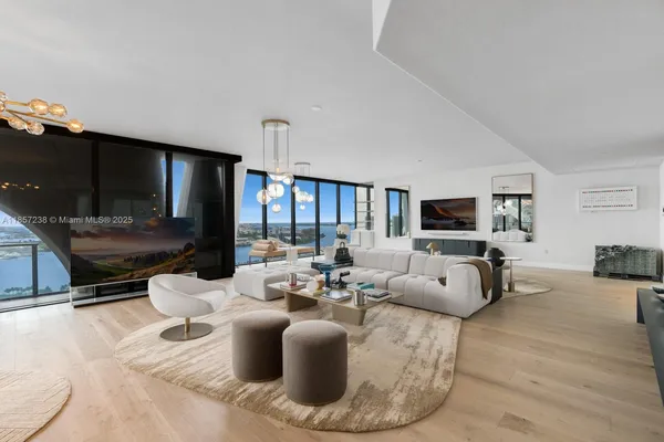 a living room with fireplace furniture and a flat screen tv