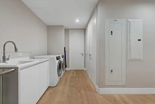 a view of a storage & utility room with a sink