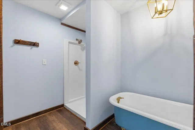 a view of roof deck with a table and chairs