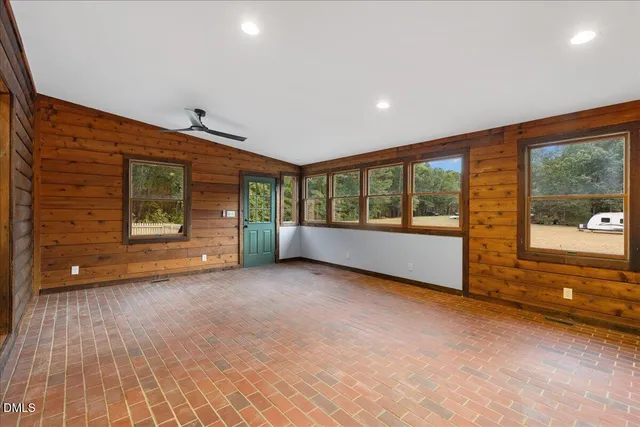 a backyard of a house with barbeque oven