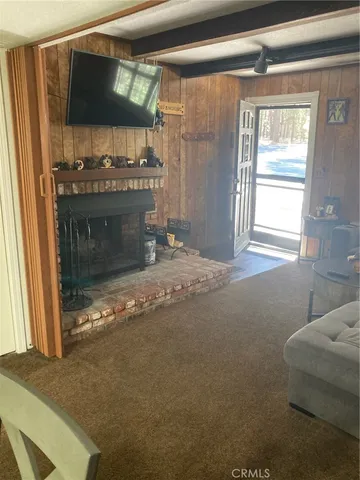 a view of a room with a bed and a window