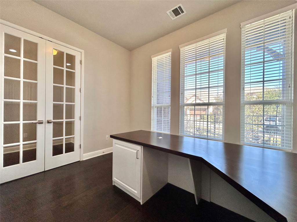 9313 Kyles Stake Road Austin, TX 78717 - Photo 15 of 40 Unfurnished office featuring dark wood-style flooring and french doors