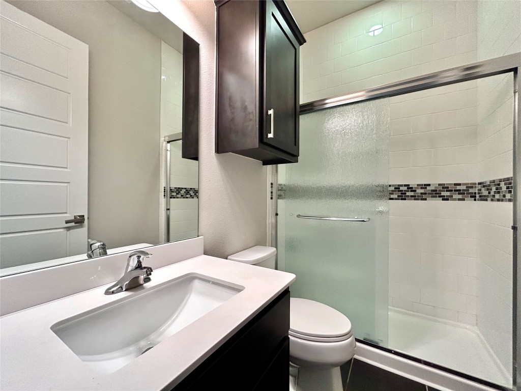 9313 Kyles Stake Road Austin, TX 78717 - Photo 24 of 40 Bathroom with vanity and a shower stall