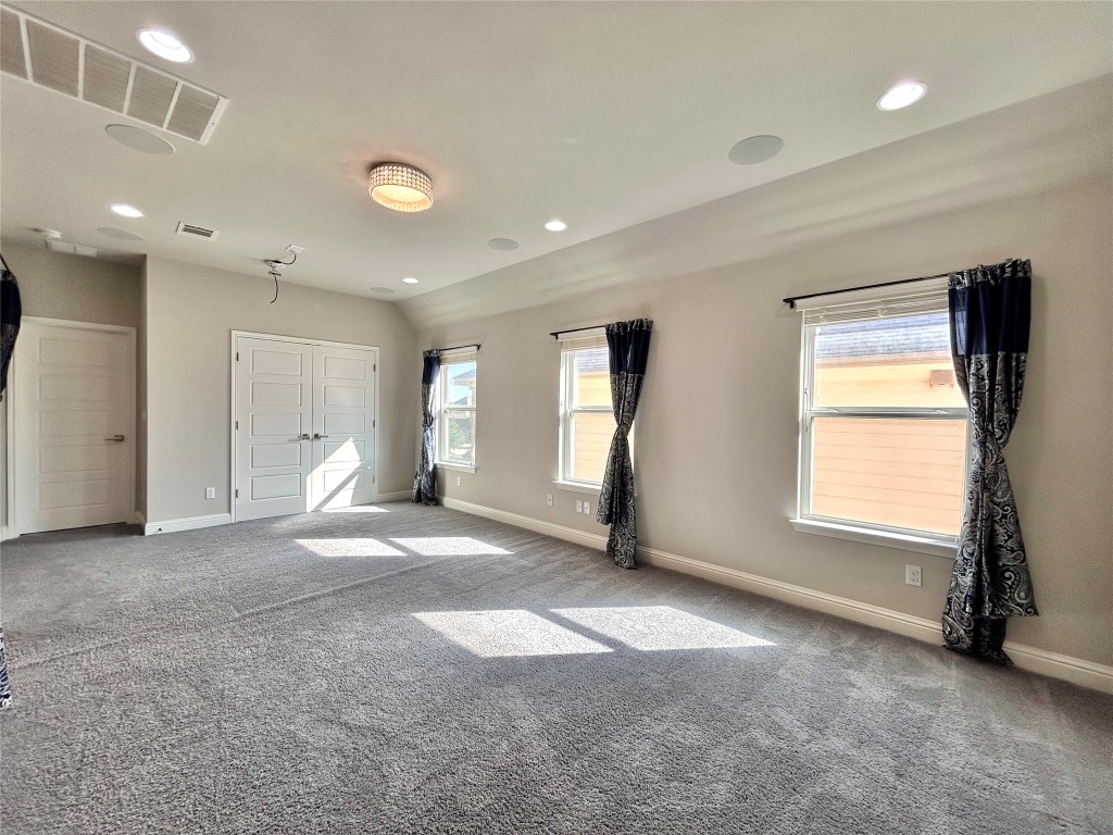 9313 Kyles Stake Road Austin, TX 78717 - Photo 26 of 40 Unfurnished bedroom with recessed lighting, carpet floors, and a closet