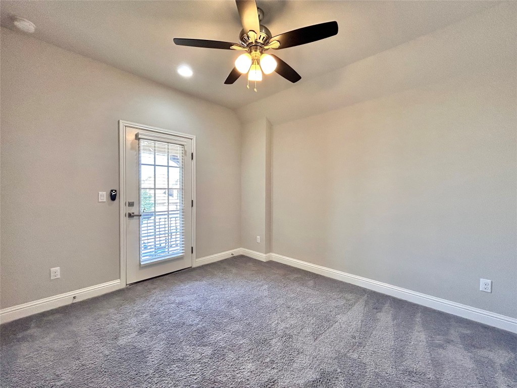 9313 Kyles Stake Road Austin, TX 78717 - Photo 27 of 40 Spare room featuring dark carpet, ceiling fan, a smoke detector, and recessed lighting