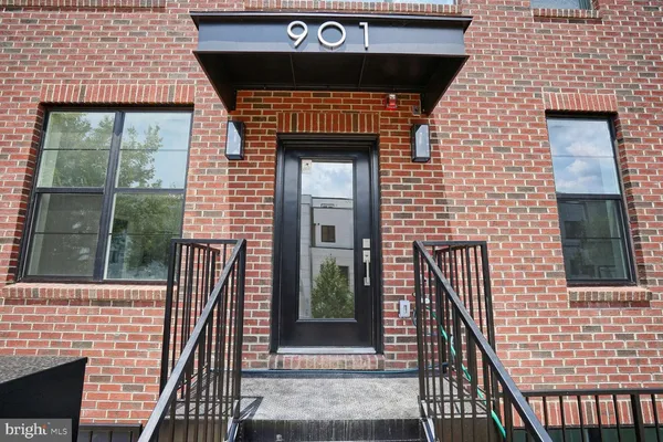 a front view of a brick house with a door