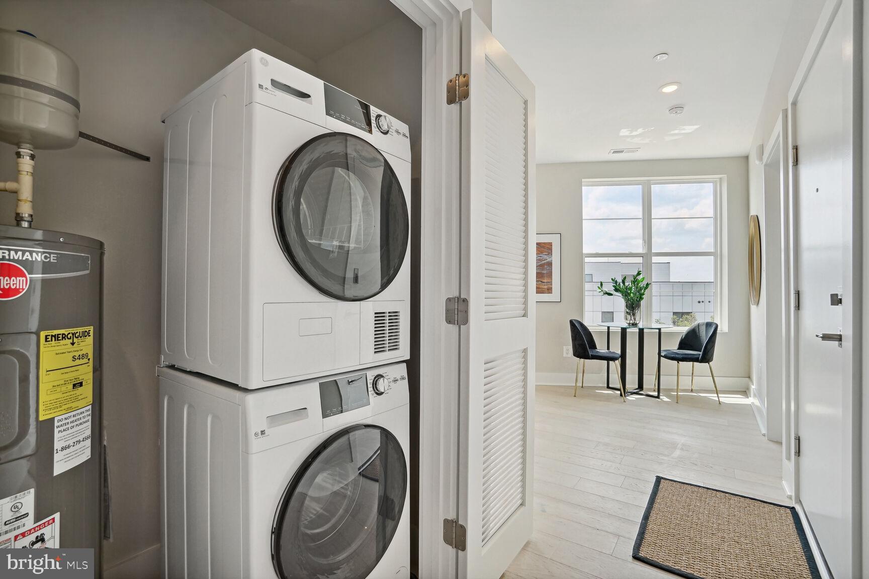 901 19th Street Northeast, Unit PH2 Washington, DC 20002 - Photo 21 of 31 a view of a hallway with washer and dryer