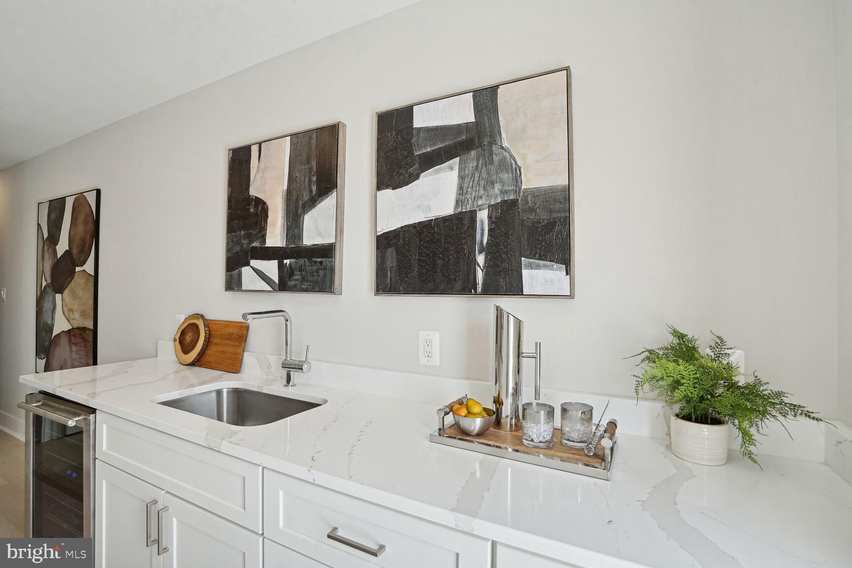 901 19th Street Northeast, Unit PH2 Washington, DC 20002 - Photo 26 of 31 a bathroom with a sink and a mirror