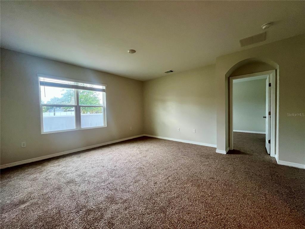 531 Auburn Grove Terrace Auburndale, FL 33823 - Photo 12 of 26 an empty room with windows