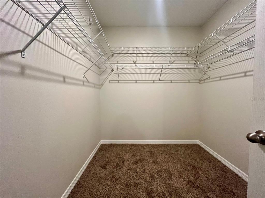 531 Auburn Grove Terrace Auburndale, FL 33823 - Photo 16 of 26 a view of a room with racks on the wall