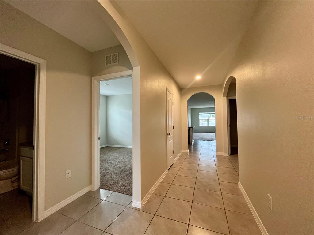 531 Auburn Grove Terrace Auburndale, FL 33823 - Photo 4 of 26 a view of a hallway view with staircase