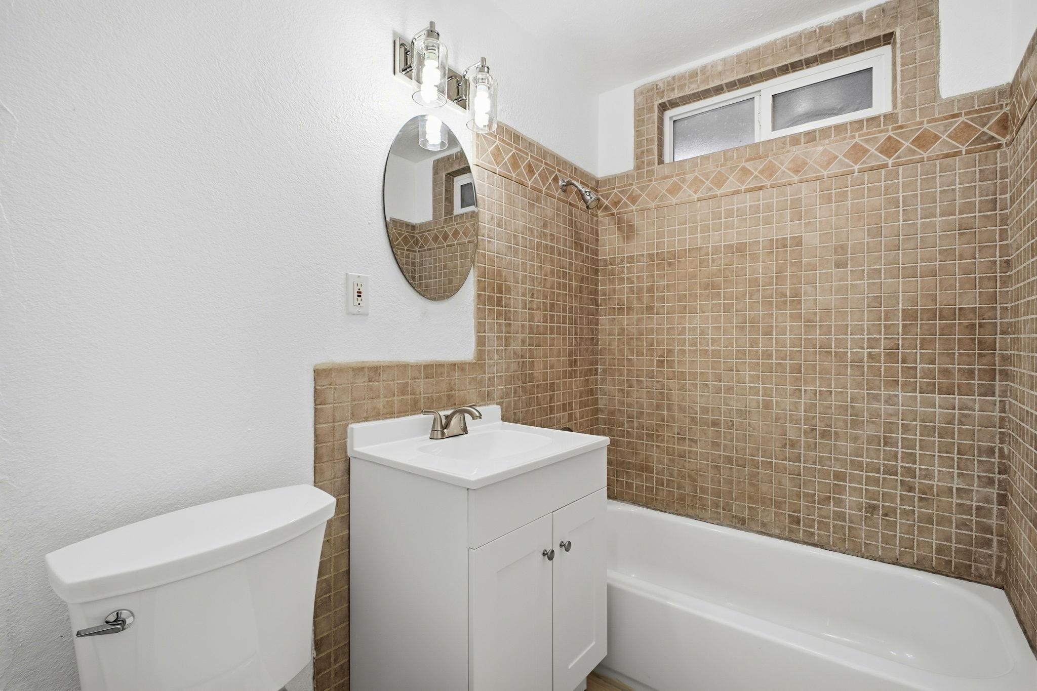 14683 Midland Road San Leandro, CA 94578 - Photo 14 of 31 a bathroom with a sink a toilet and shower