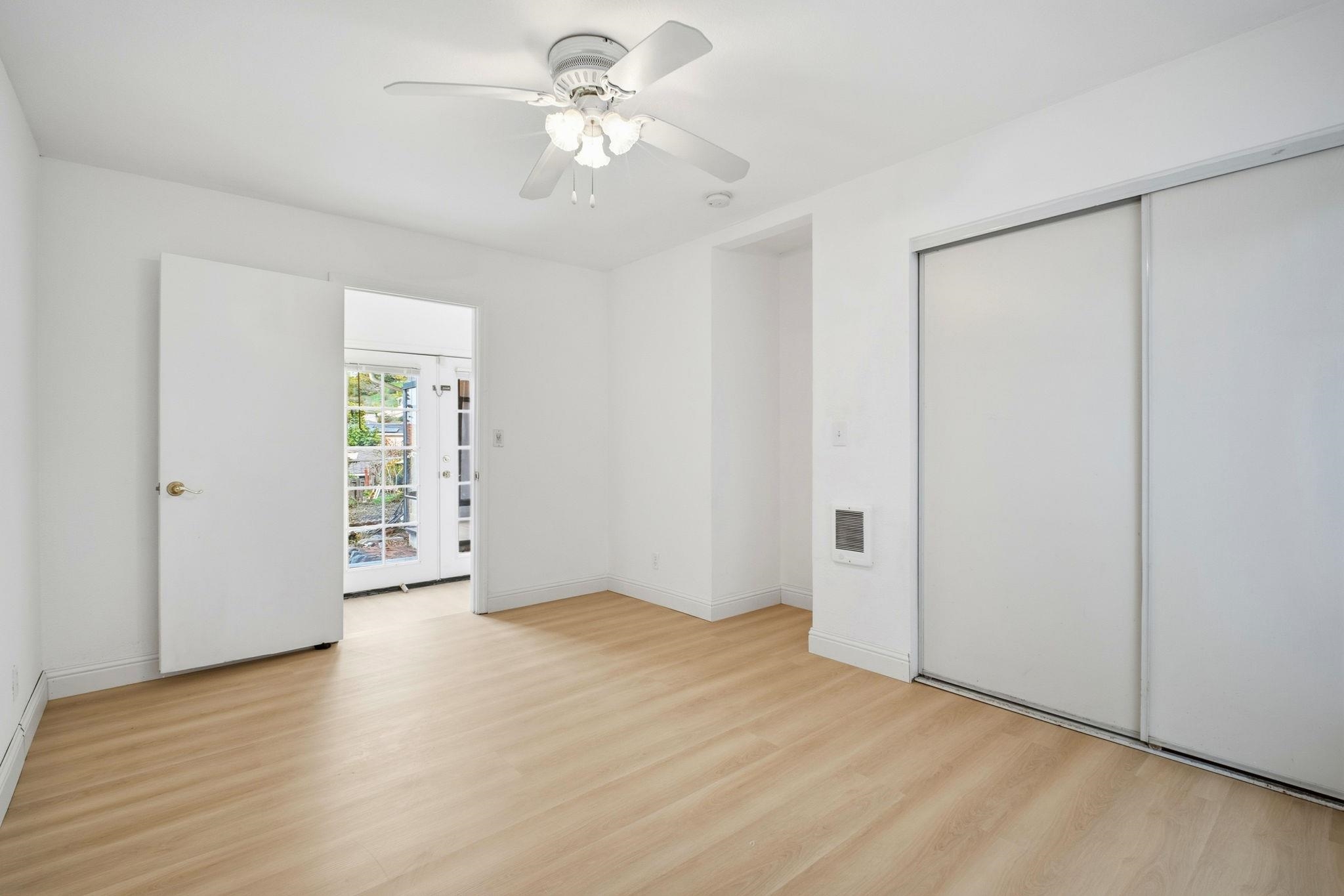 14683 Midland Road San Leandro, CA 94578 - Photo 16 of 31 wooden floor in an empty room with a window