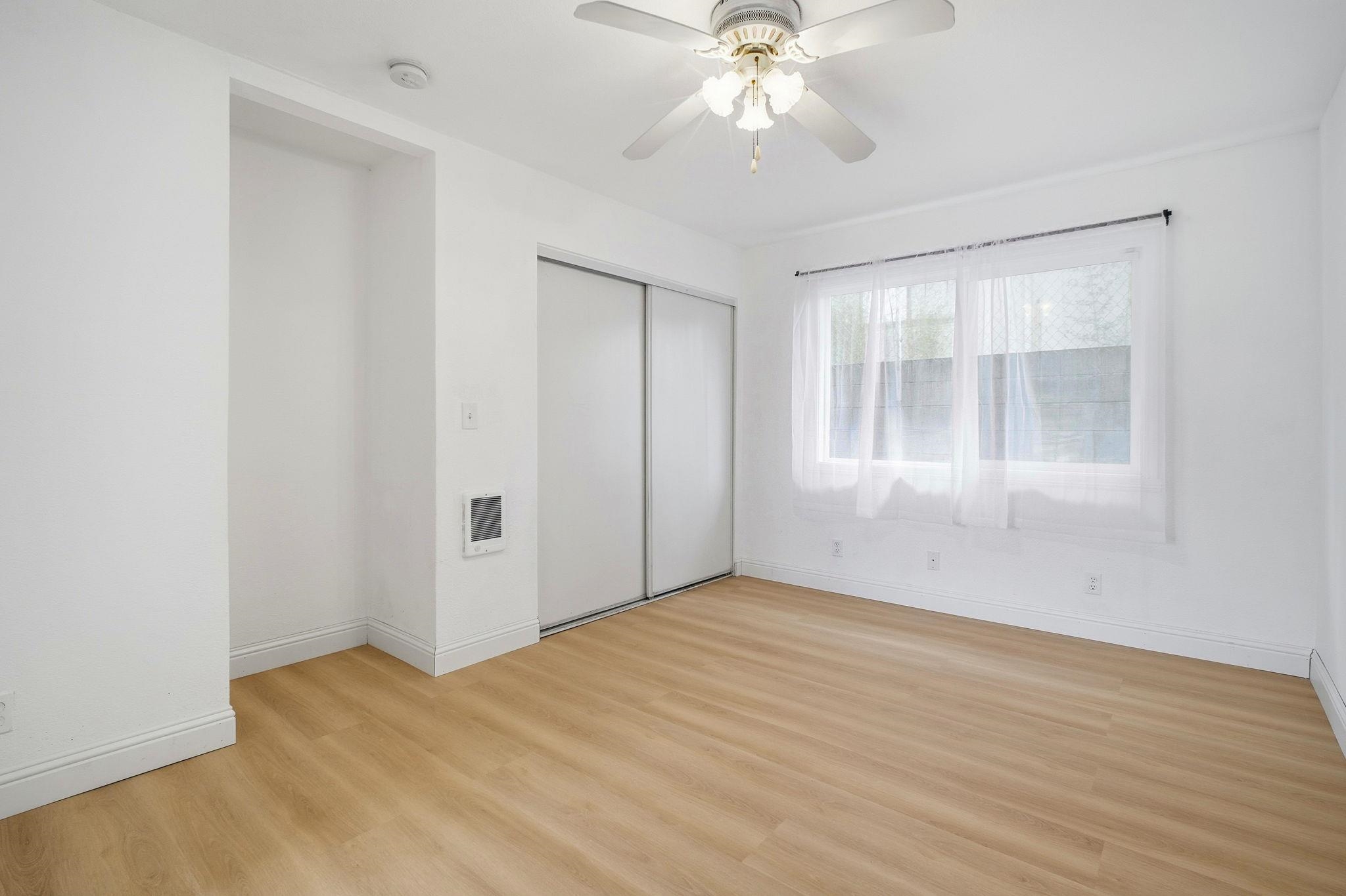 14683 Midland Road San Leandro, CA 94578 - Photo 17 of 31 a view of an empty room with wooden floor and a window