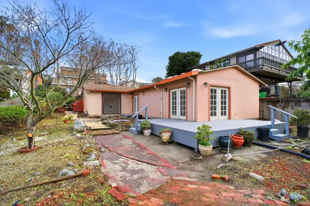 a front view of a house with sitting area