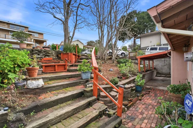 a view of a backyard with sitting area
