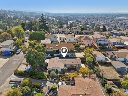 an aerial view of a city with lots of residential buildings