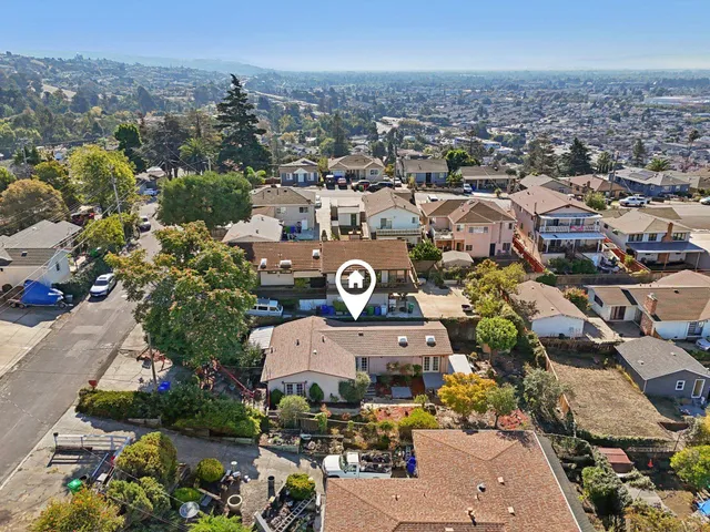 an aerial view of a city with lots of residential buildings