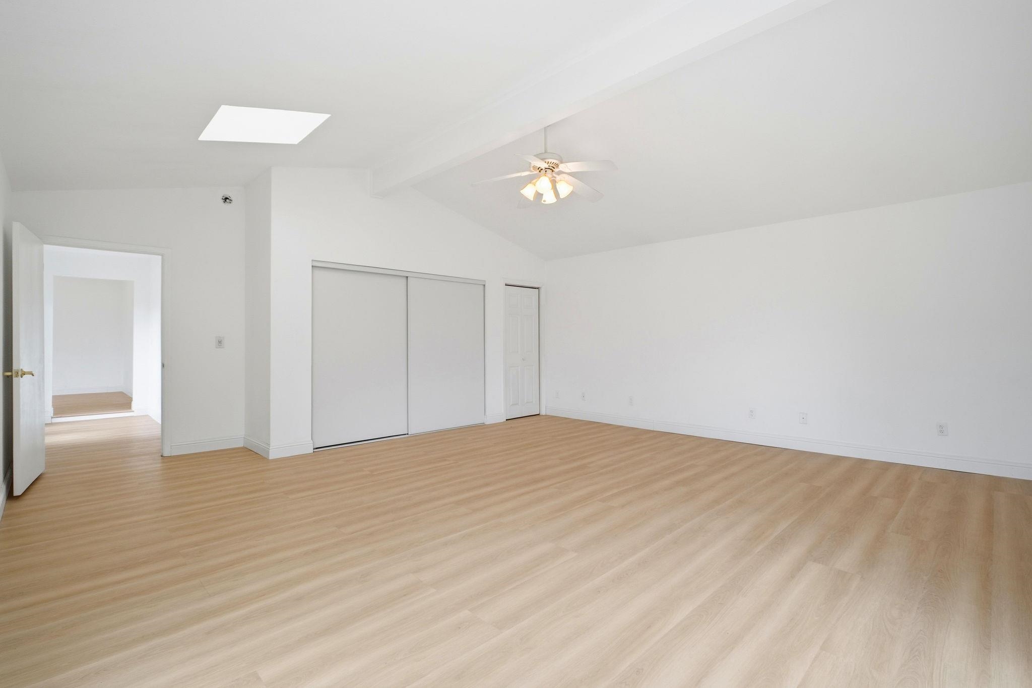 14683 Midland Road San Leandro, CA 94578 - Photo 4 of 31 a view of empty room with wooden floor and ceiling fan
