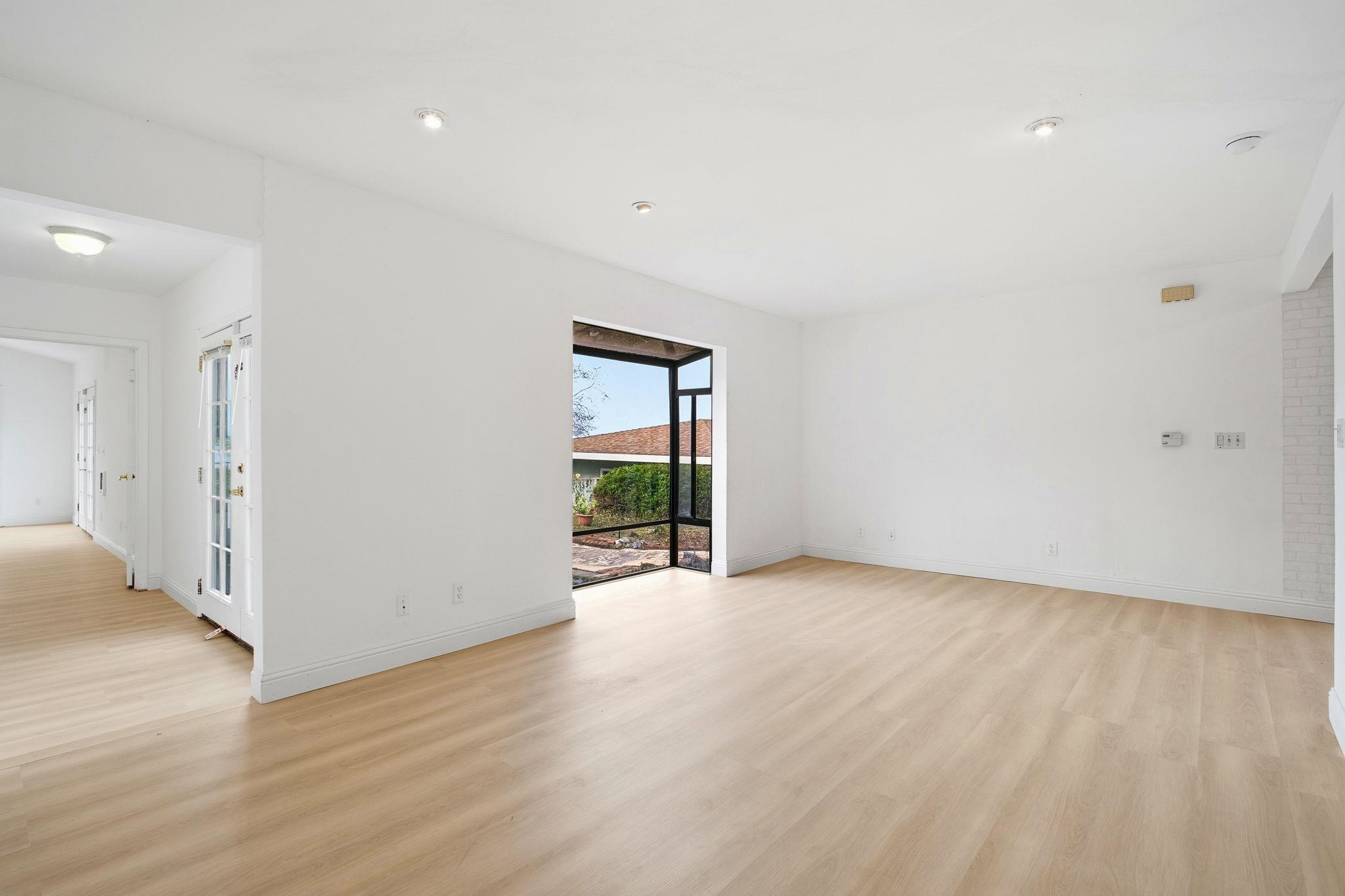 14683 Midland Road San Leandro, CA 94578 - Photo 7 of 31 a view of an empty room with wooden floor and a window