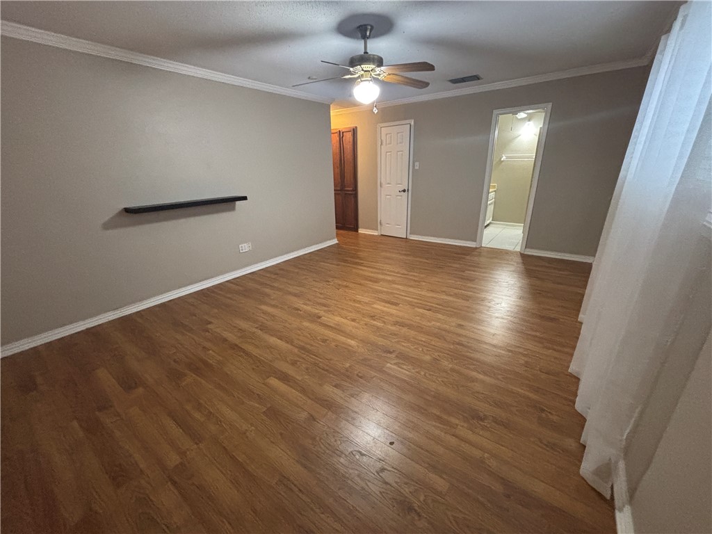 4957 Shadowbend Drive Corpus Christi, TX 78413 - Photo 24 of 35 wooden floor in an empty room with a window