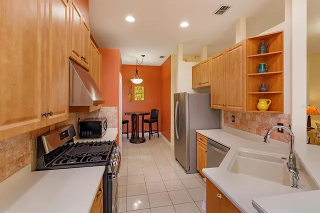 a view of a dining room with furniture and a window
