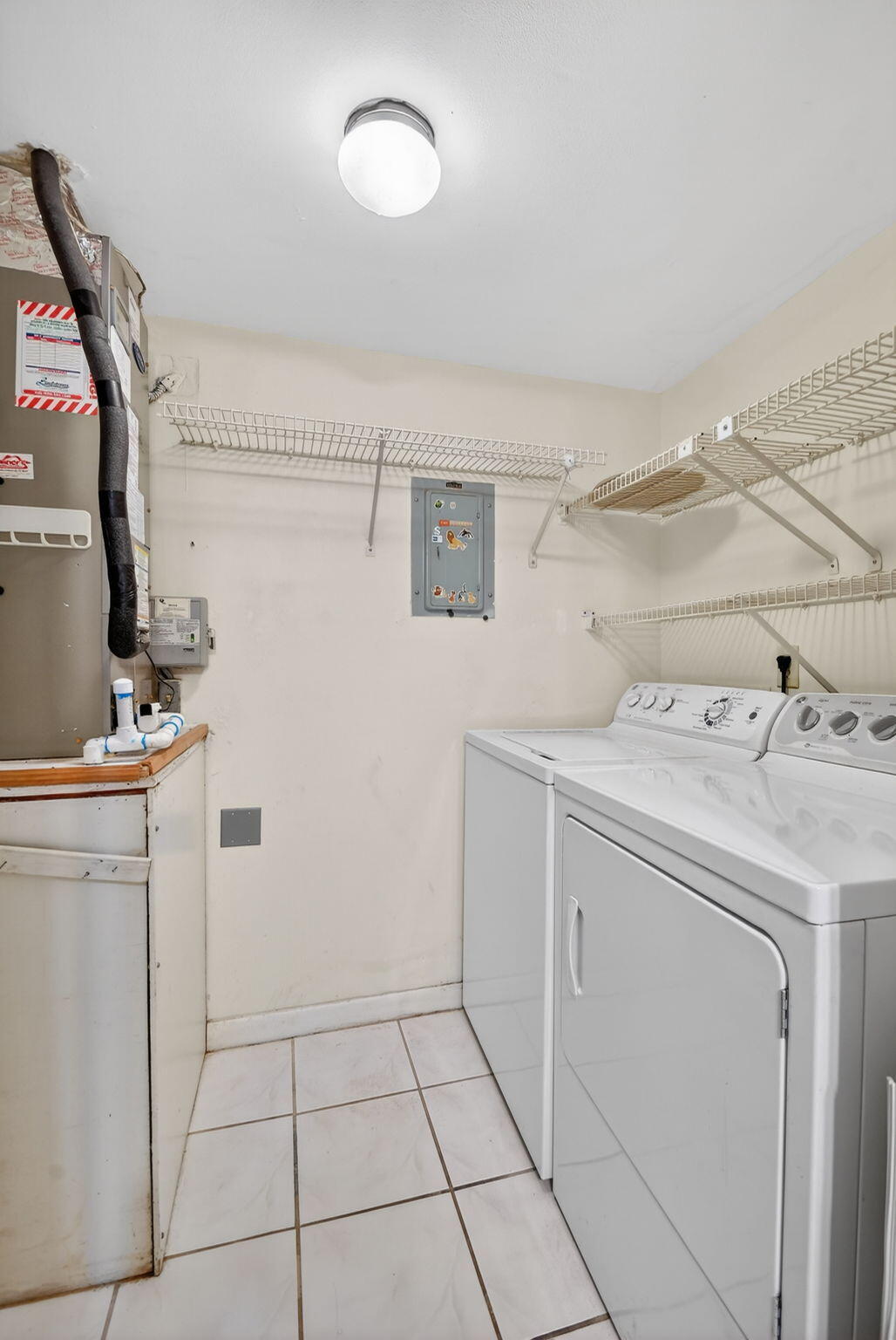328 Pine Ridge Circle, Unit C1 Greenacres, FL 33463 - Photo 20 of 47 a utility room with dryer and washer
