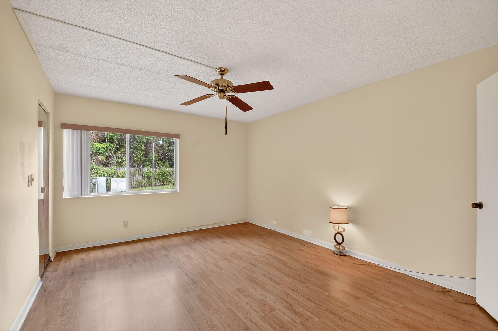 328 Pine Ridge Circle, Unit C1 Greenacres, FL 33463 - Photo 21 of 47 wooden floor in an empty room with a window