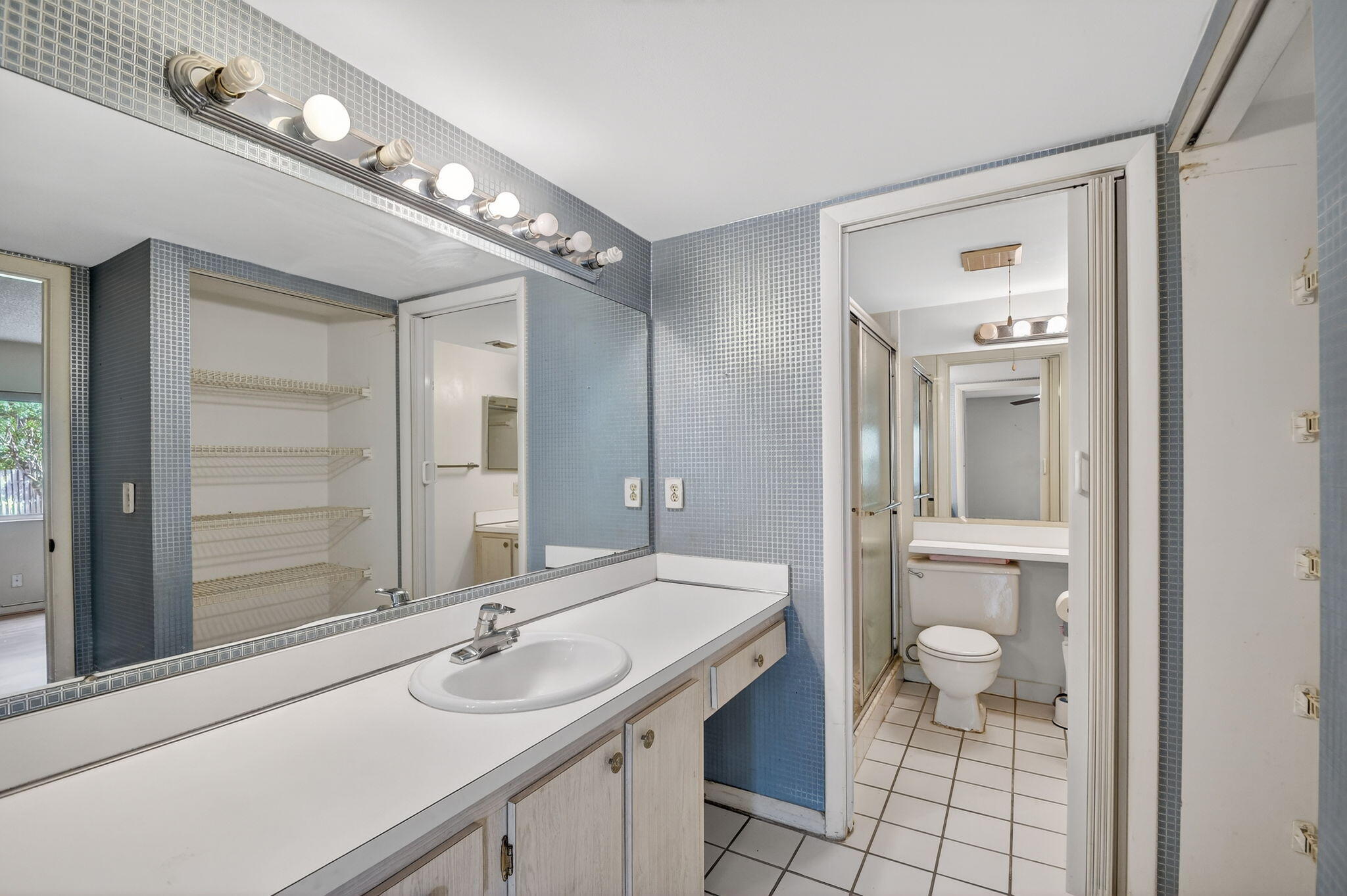 328 Pine Ridge Circle, Unit C1 Greenacres, FL 33463 - Photo 24 of 47 a bathroom with a sink a toilet and shower