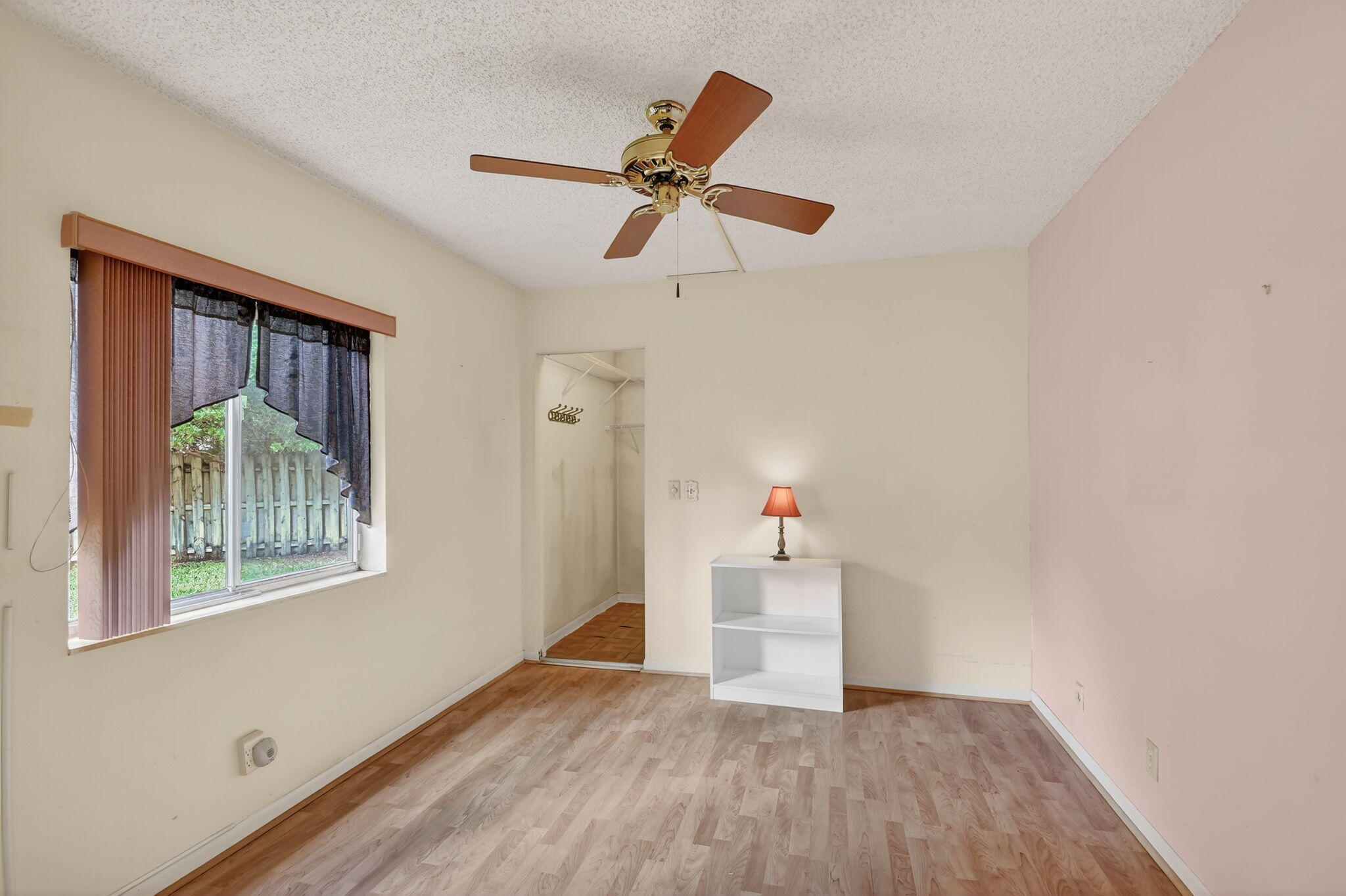 328 Pine Ridge Circle, Unit C1 Greenacres, FL 33463 - Photo 28 of 47 a view of empty room with wooden floor and ceiling fan