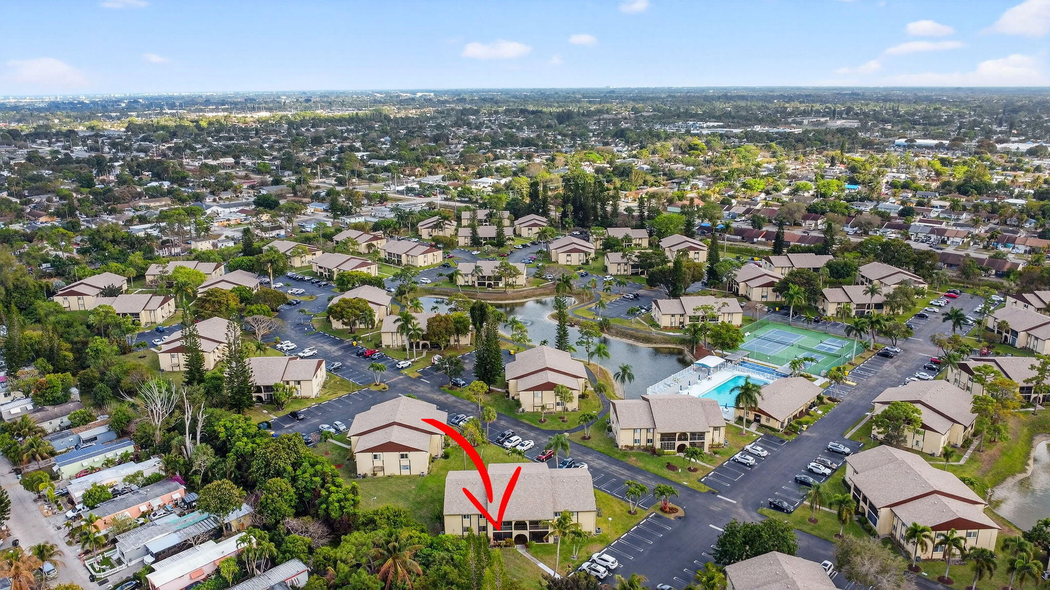 328 Pine Ridge Circle, Unit C1 Greenacres, FL 33463 - Photo 34 of 47 an aerial view of residential houses with outdoor space
