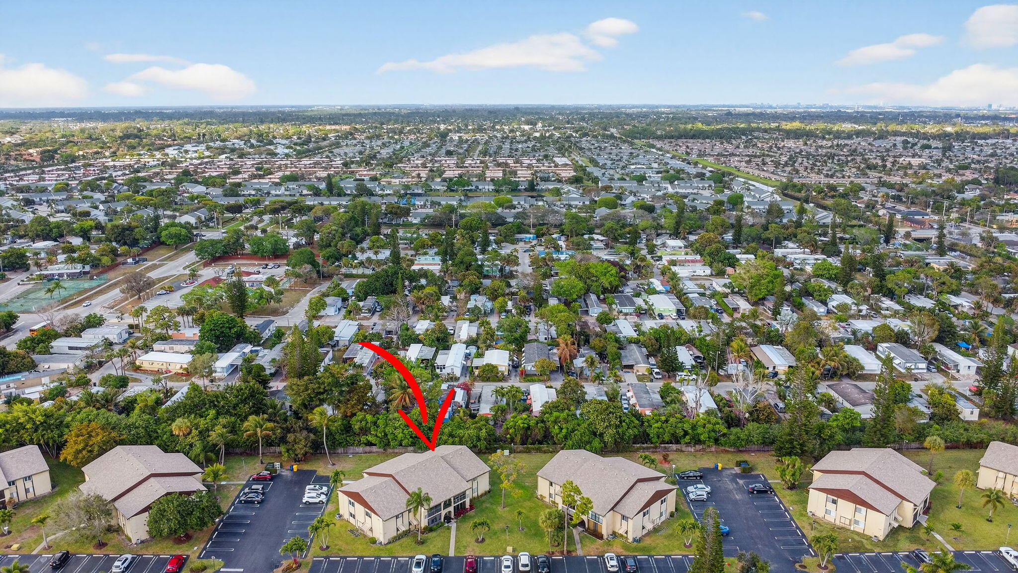 328 Pine Ridge Circle, Unit C1 Greenacres, FL 33463 - Photo 38 of 47 an aerial view of residential houses with outdoor space and trees
