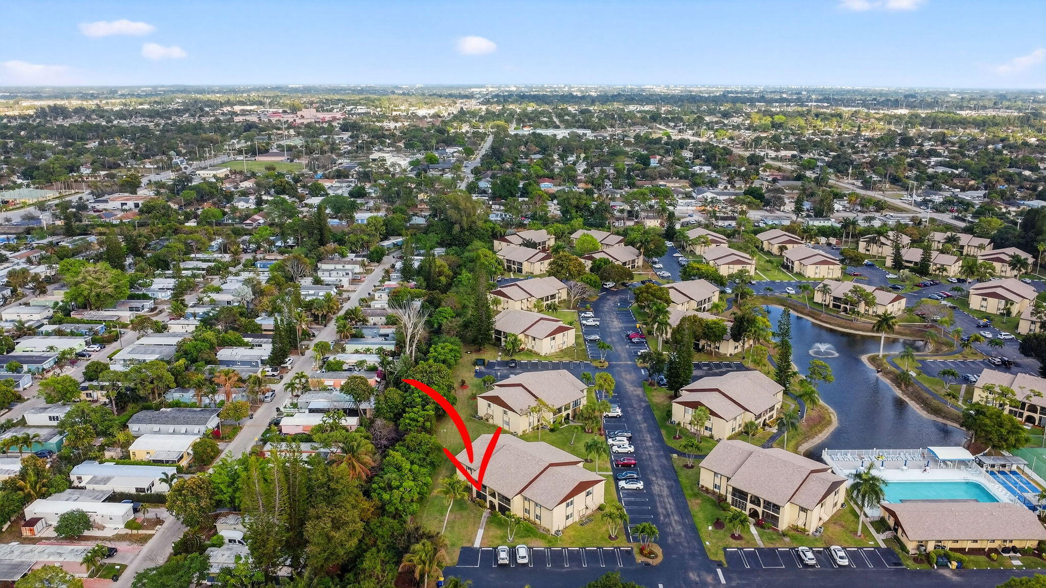 328 Pine Ridge Circle, Unit C1 Greenacres, FL 33463 - Photo 39 of 47 an aerial view of residential houses with outdoor space