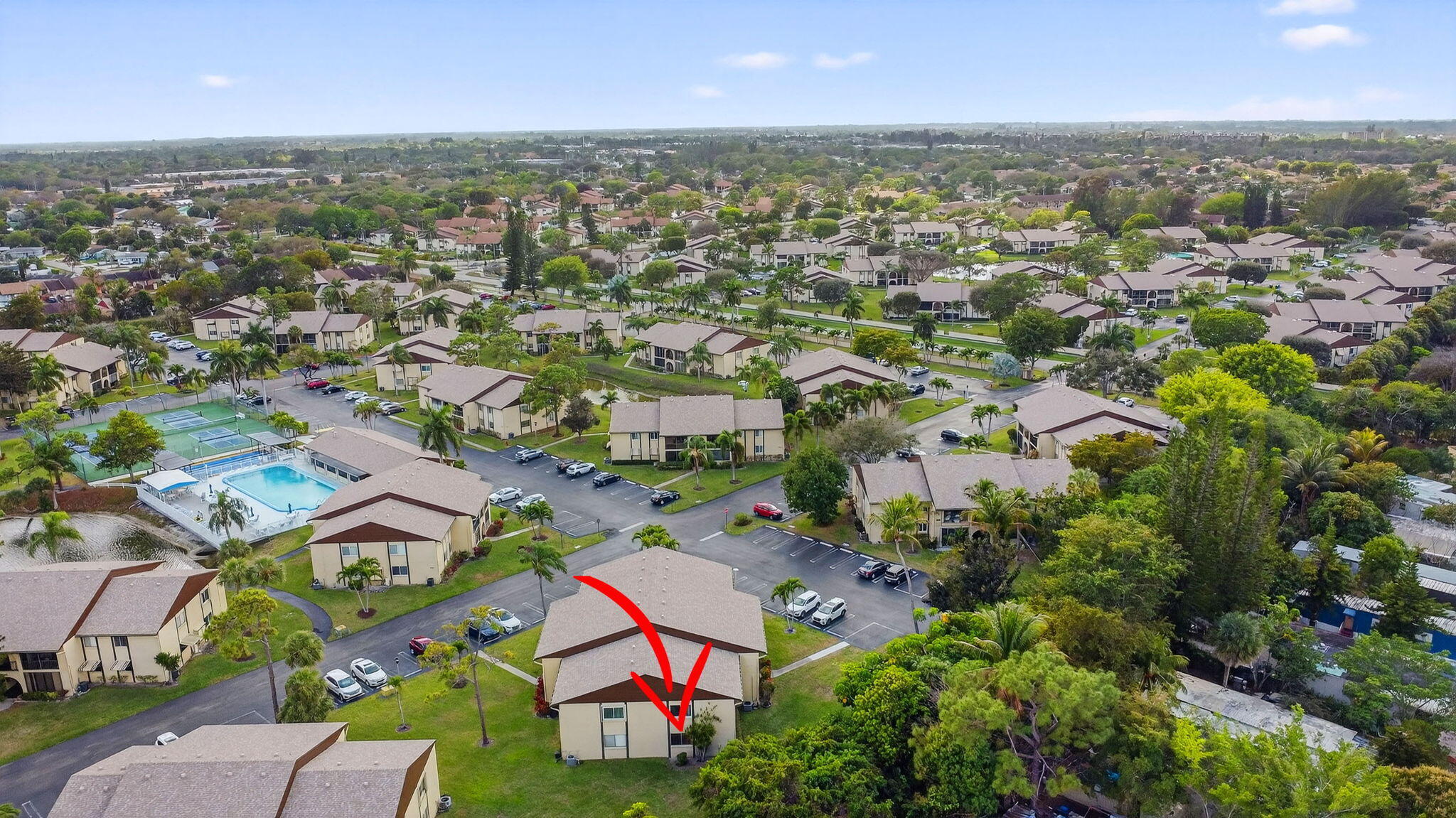 328 Pine Ridge Circle, Unit C1 Greenacres, FL 33463 - Photo 40 of 47 an aerial view of a city with lots of residential buildings