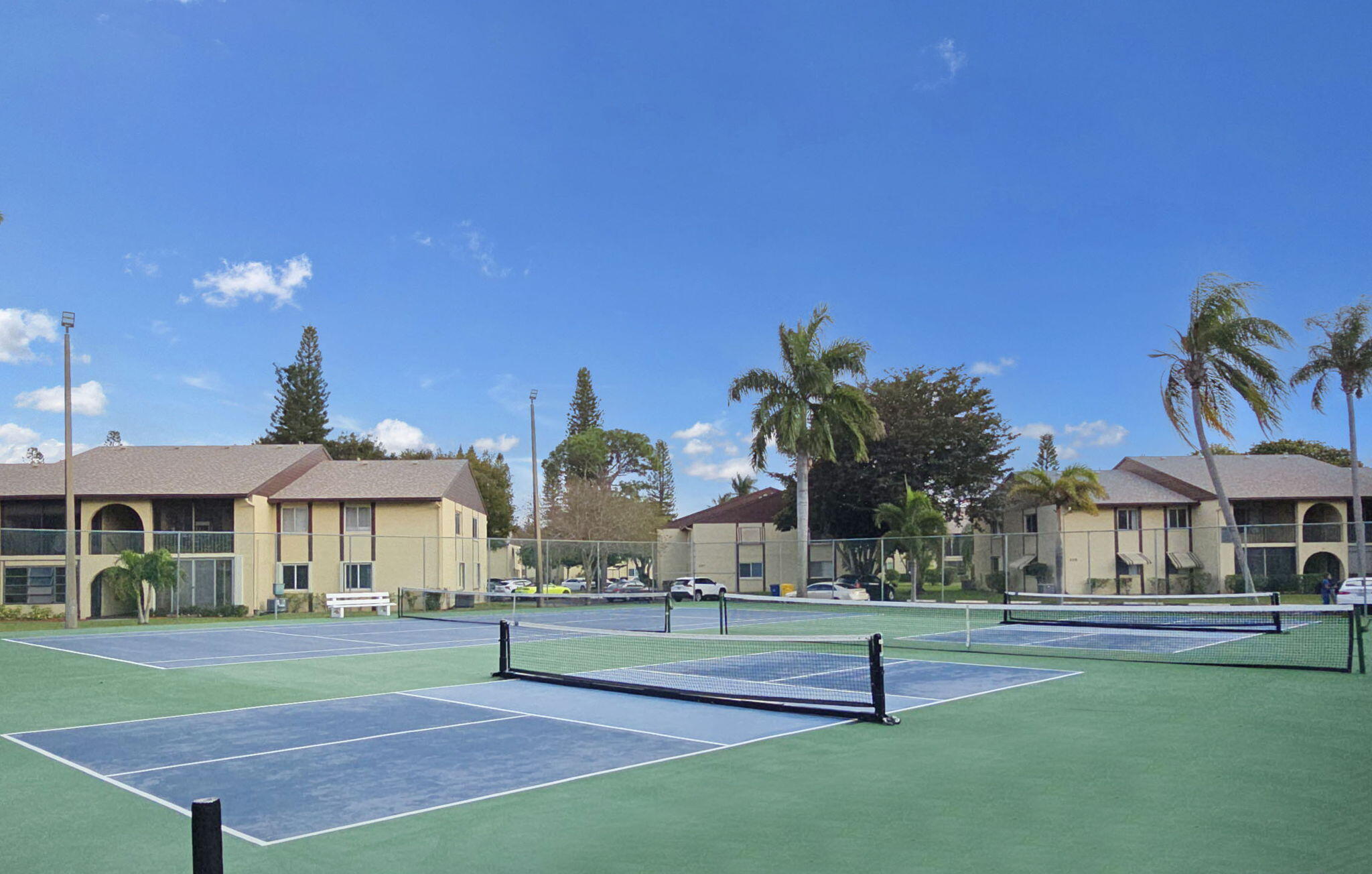 328 Pine Ridge Circle, Unit C1 Greenacres, FL 33463 - Photo 42 of 47 a building with trees in front of it