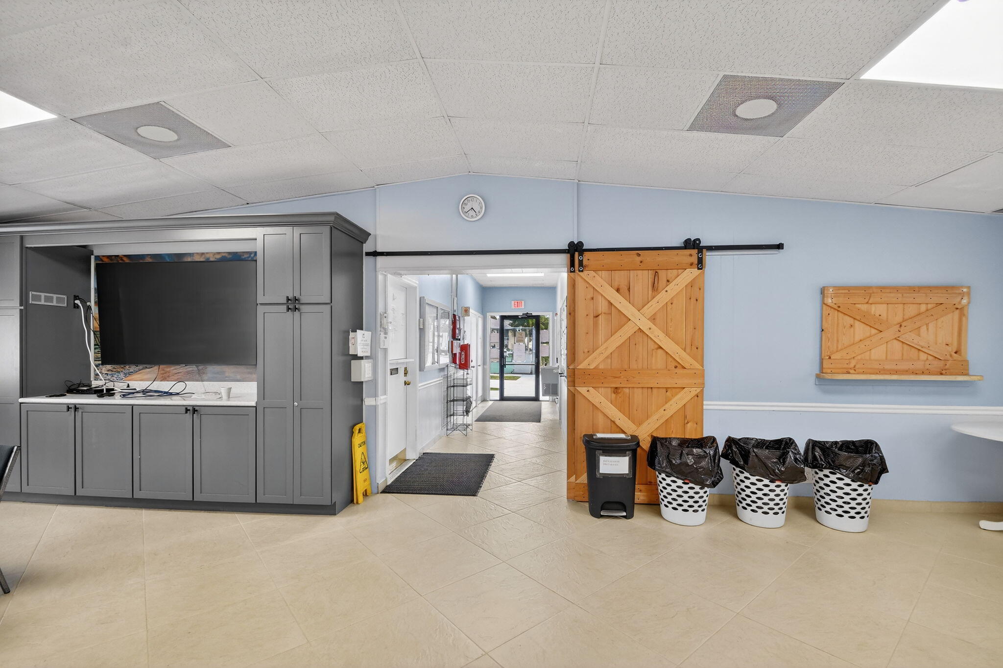 328 Pine Ridge Circle, Unit C1 Greenacres, FL 33463 - Photo 44 of 47 a room with furniture and a flat screen tv