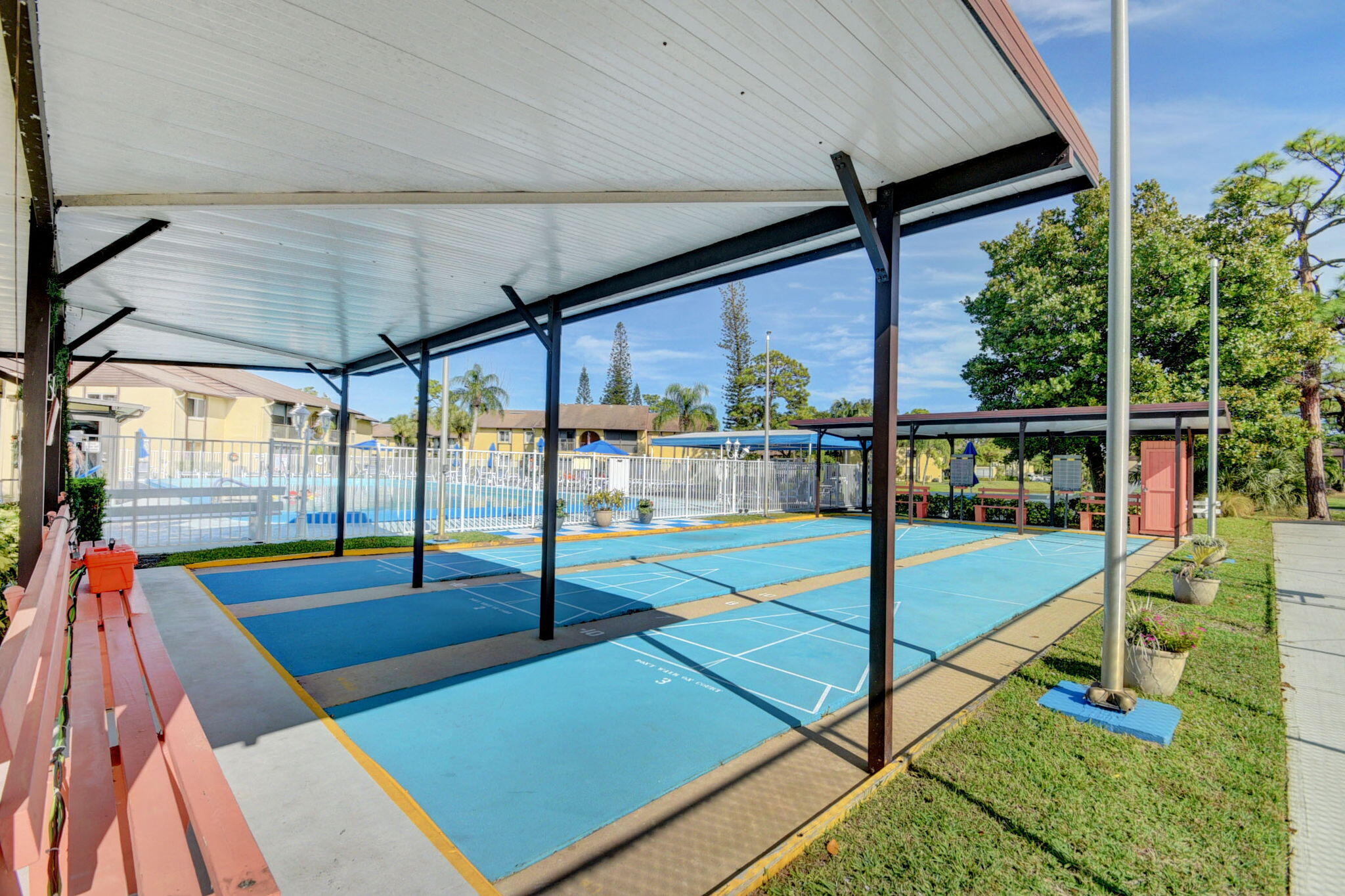 328 Pine Ridge Circle, Unit C1 Greenacres, FL 33463 - Photo 45 of 47 a view of a porch with furniture and garden