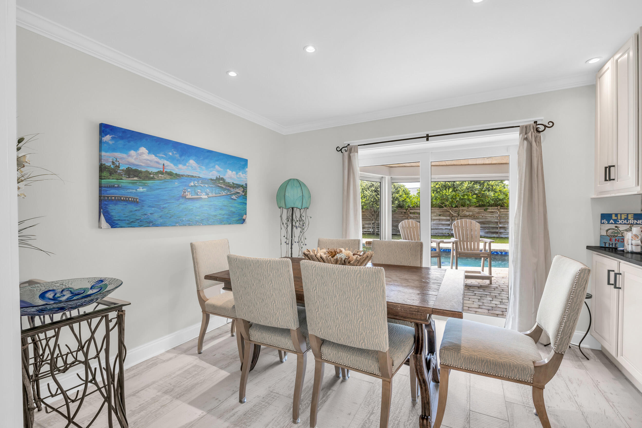 11 Southeast Splitrail Circle Jupiter, FL 33469 - Photo 12 of 48 a view of a dining room with furniture large window and outside view