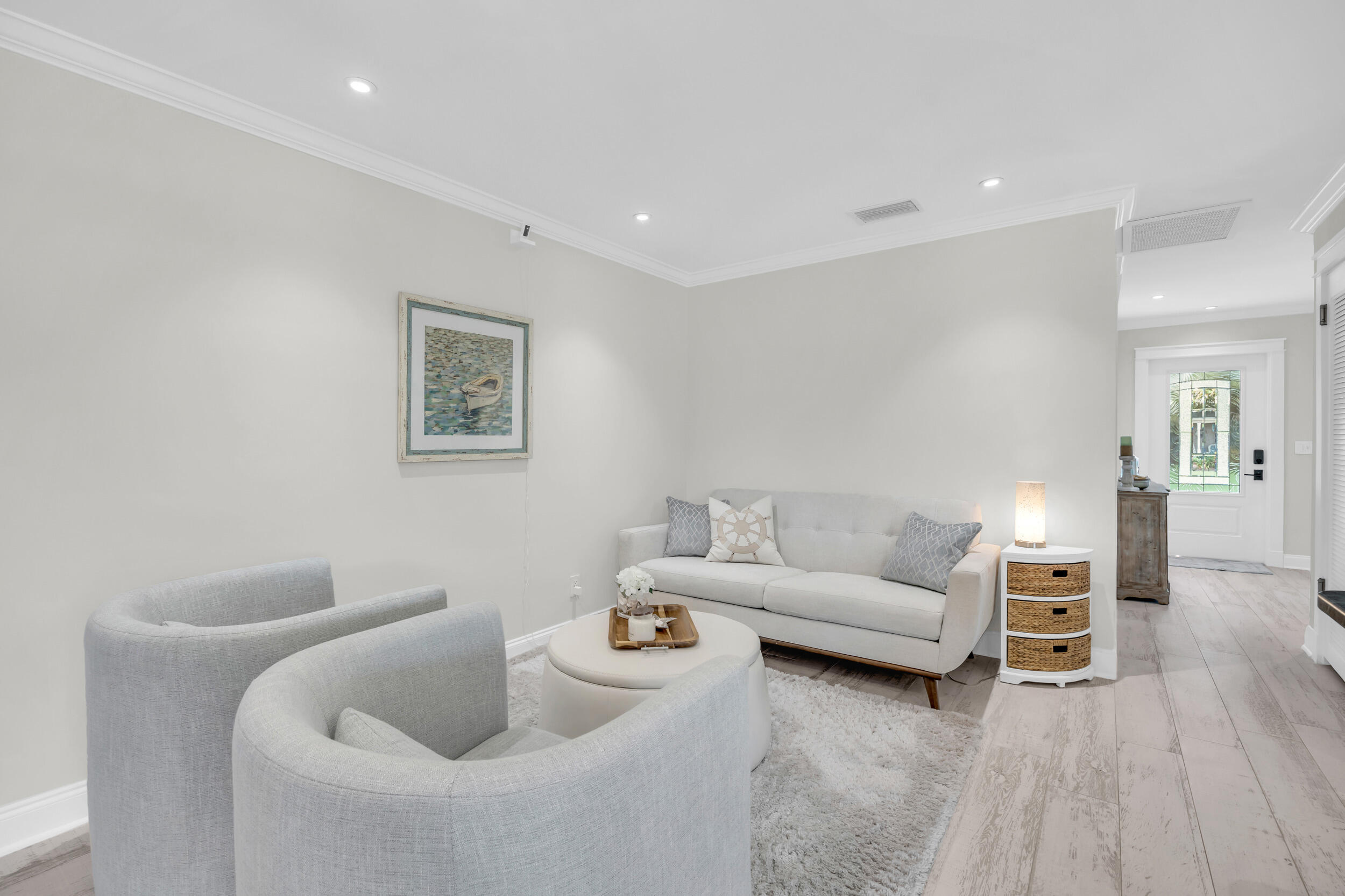 11 Southeast Splitrail Circle Jupiter, FL 33469 - Photo 17 of 48 a living room with furniture and a wooden floor