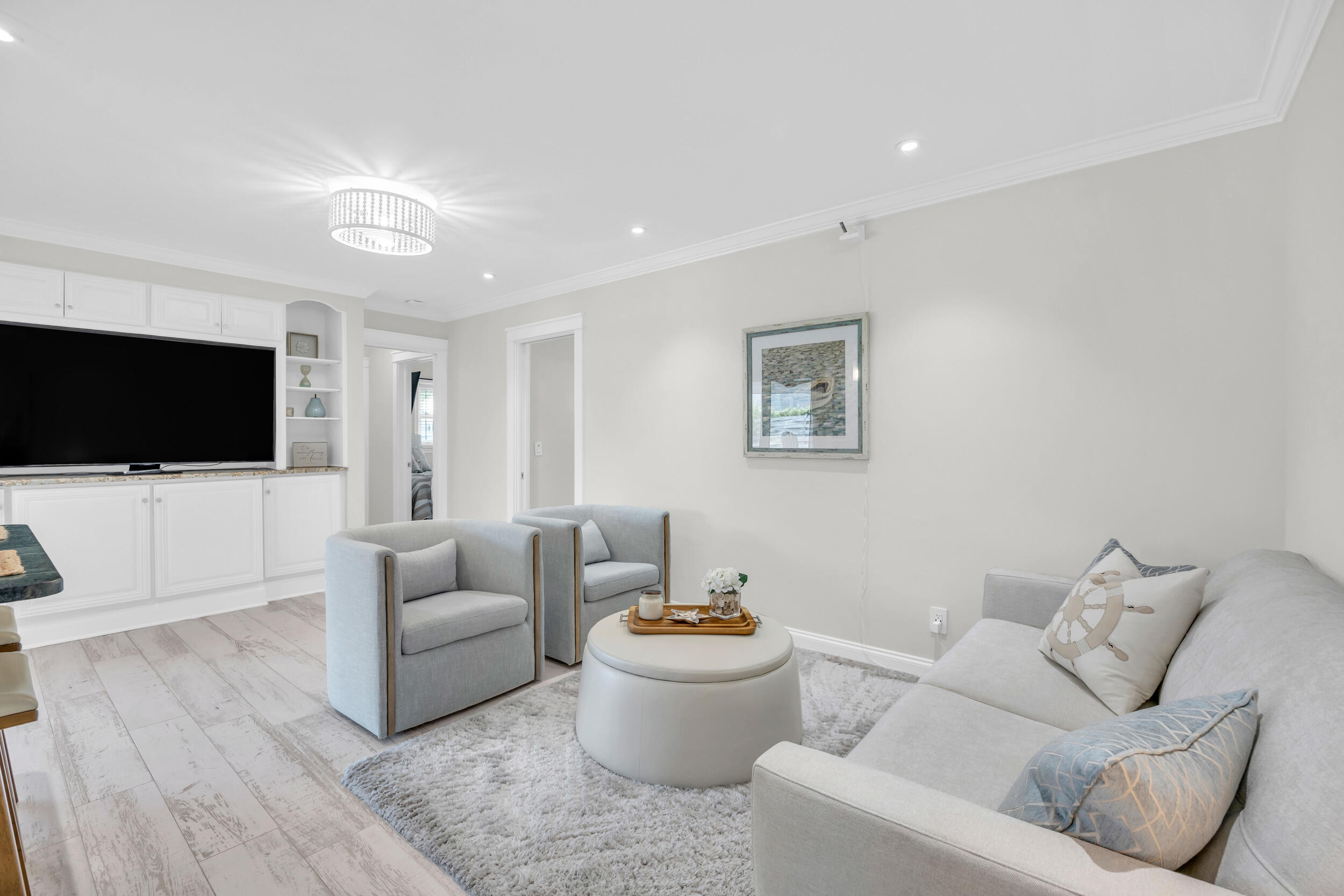 11 Southeast Splitrail Circle Jupiter, FL 33469 - Photo 18 of 48 a living room with furniture and a flat screen tv