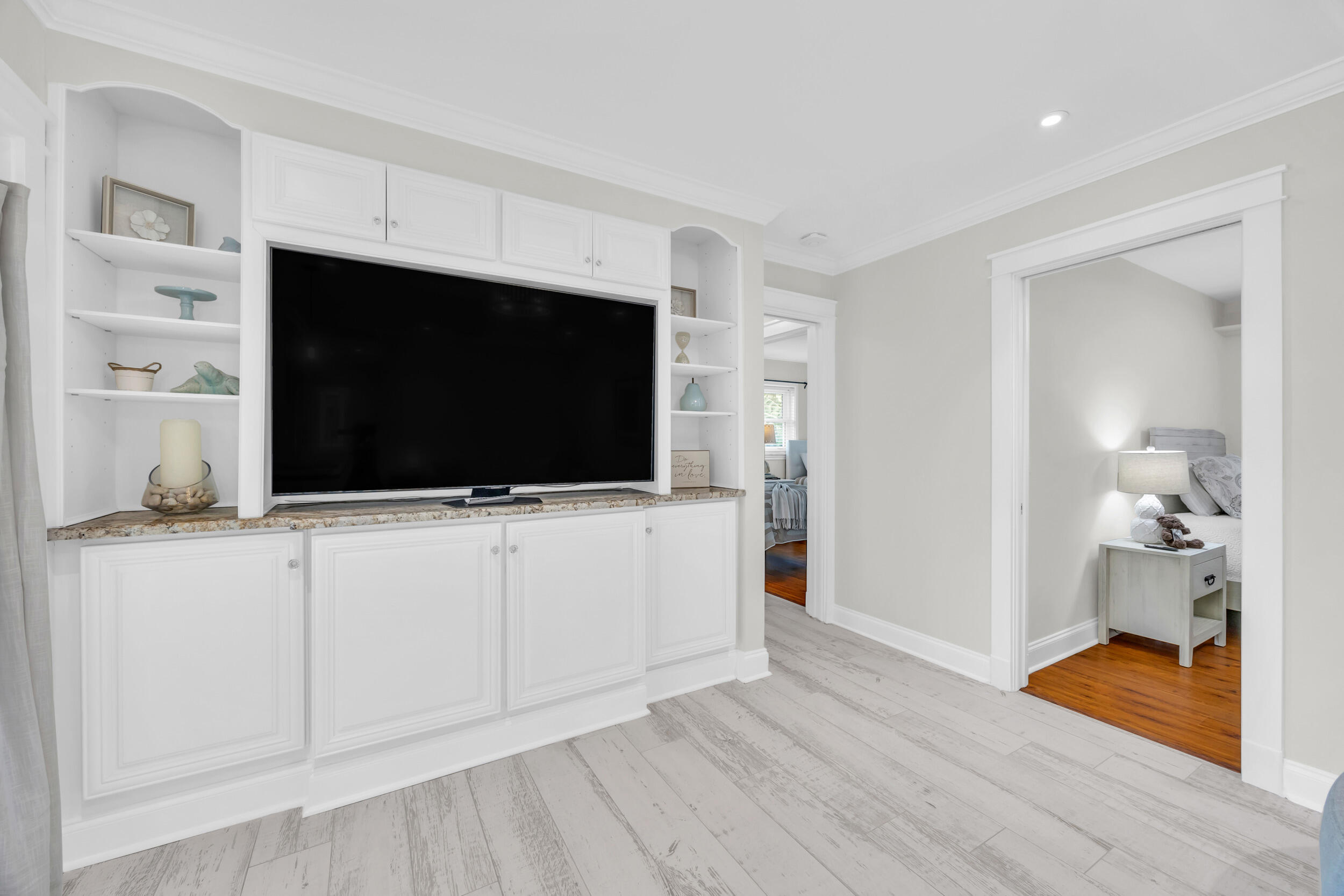 11 Southeast Splitrail Circle Jupiter, FL 33469 - Photo 21 of 48 a living room with flat screen tv and dresser