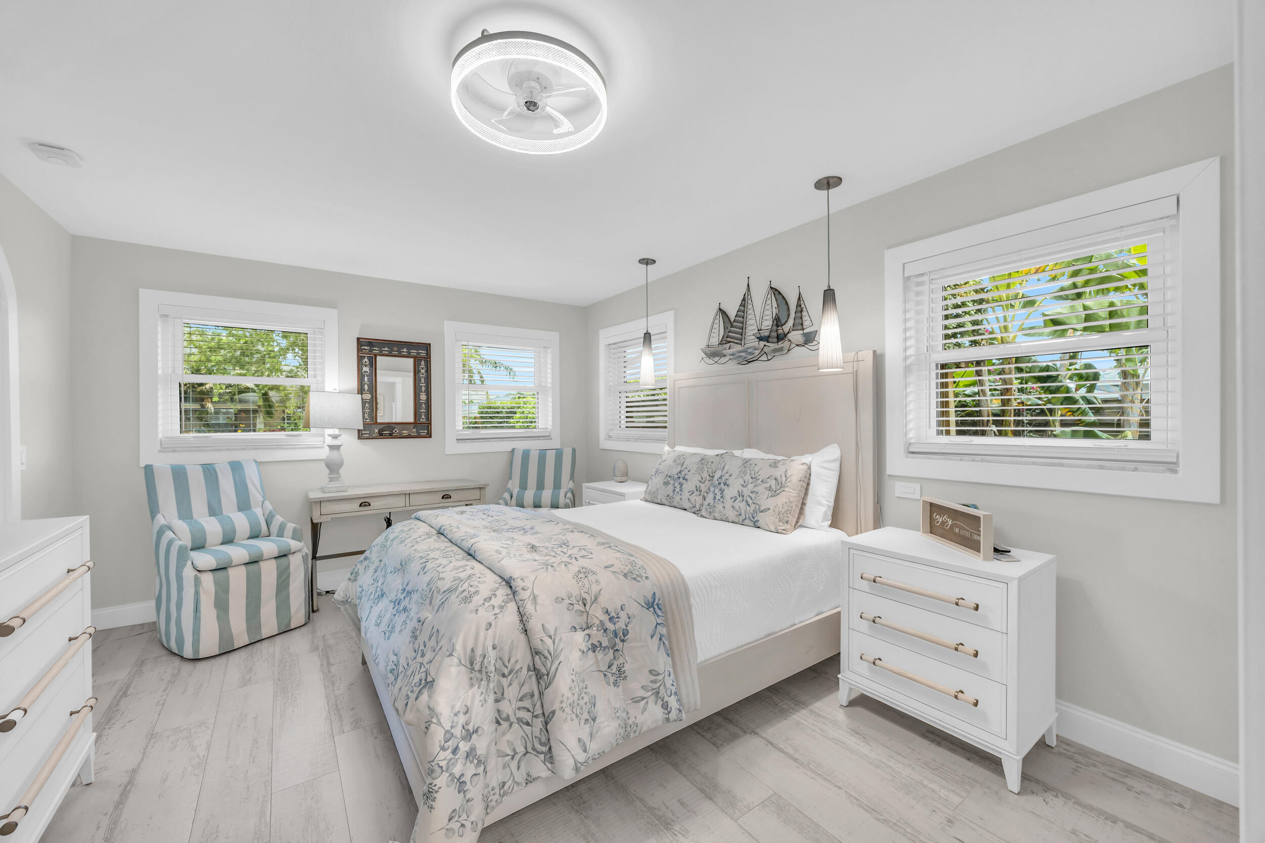 11 Southeast Splitrail Circle Jupiter, FL 33469 - Photo 23 of 48 a bedroom with a bed and a window