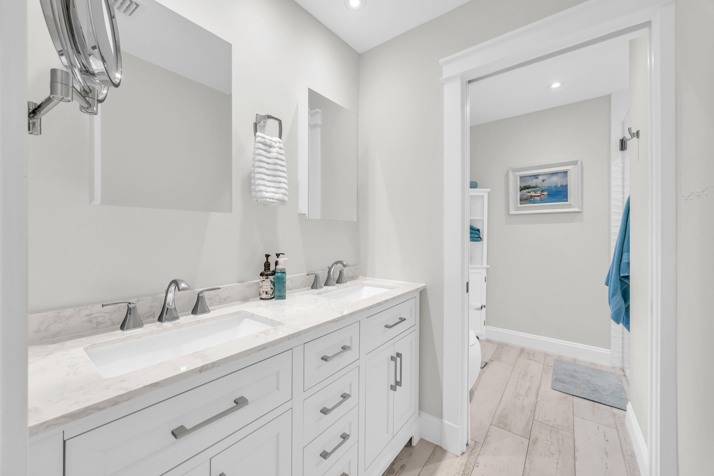 11 Southeast Splitrail Circle Jupiter, FL 33469 - Photo 25 of 48 a bathroom with a sink a vanity and a mirror