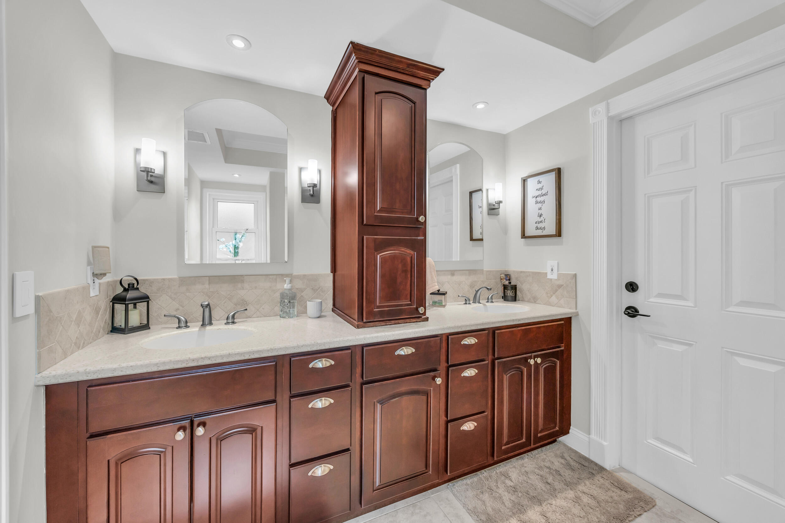 11 Southeast Splitrail Circle Jupiter, FL 33469 - Photo 30 of 48 a bathroom with a double vanity sink double and mirror