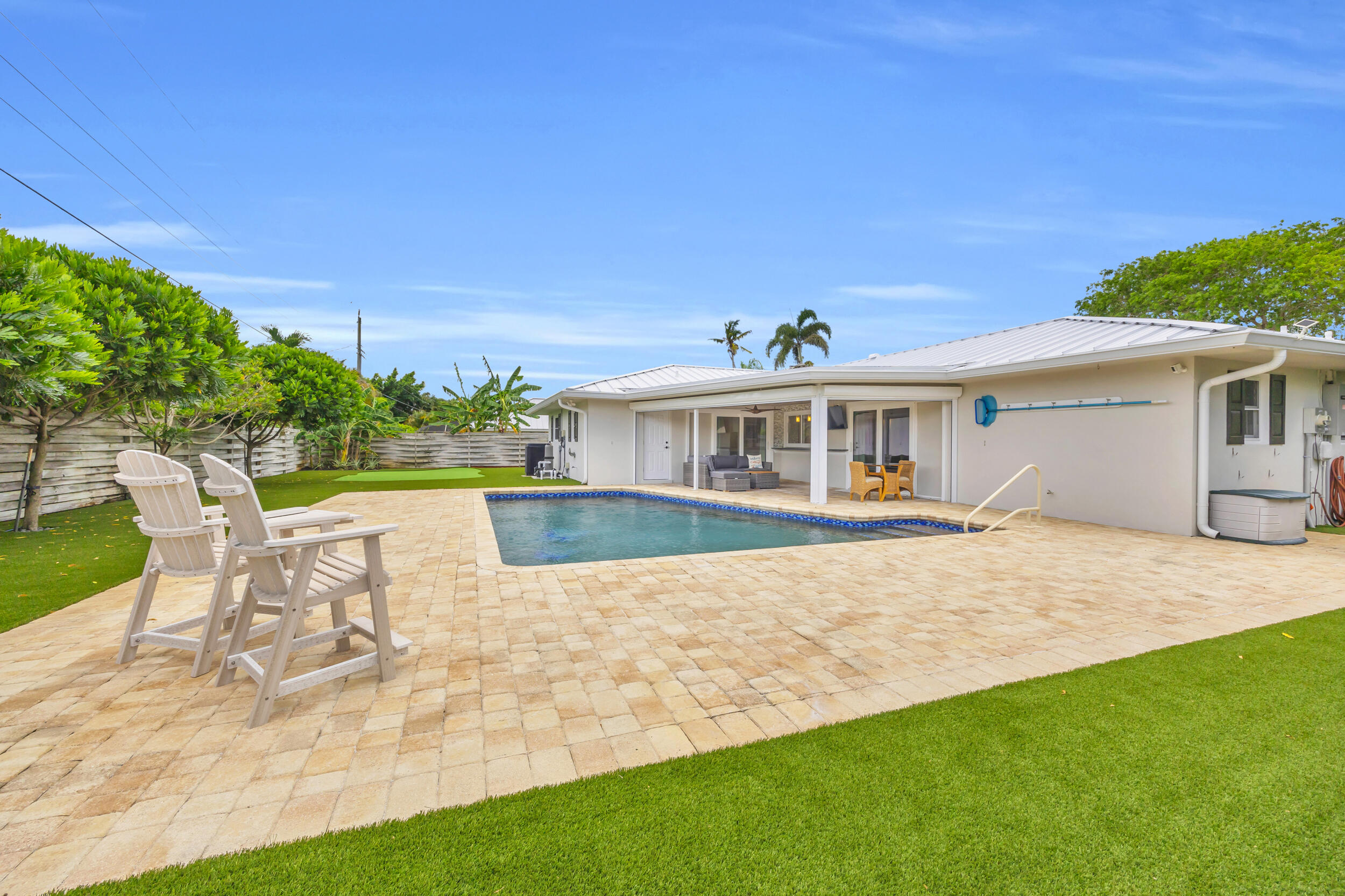 11 Southeast Splitrail Circle Jupiter, FL 33469 - Photo 37 of 48 a view of house with swimming pool outdoor seating