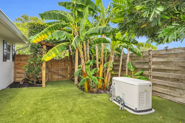 a view of a swimming pool with a yard