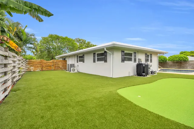 an aerial view of a house with a swimming pool