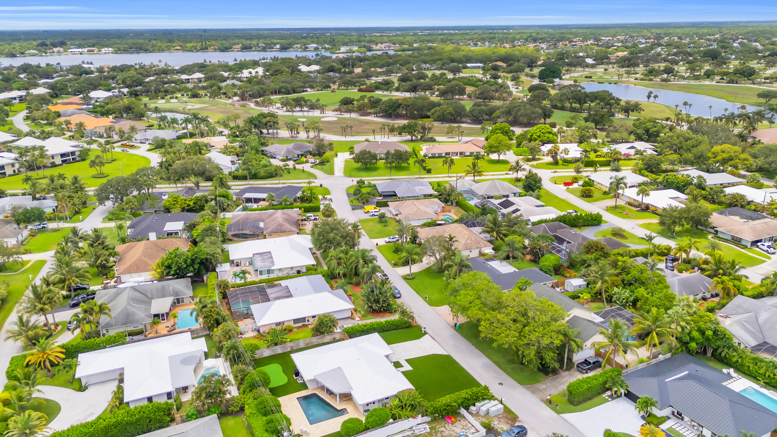 11 Southeast Splitrail Circle Jupiter, FL 33469 - Photo 45 of 48 an aerial view of residential houses with outdoor space and street view