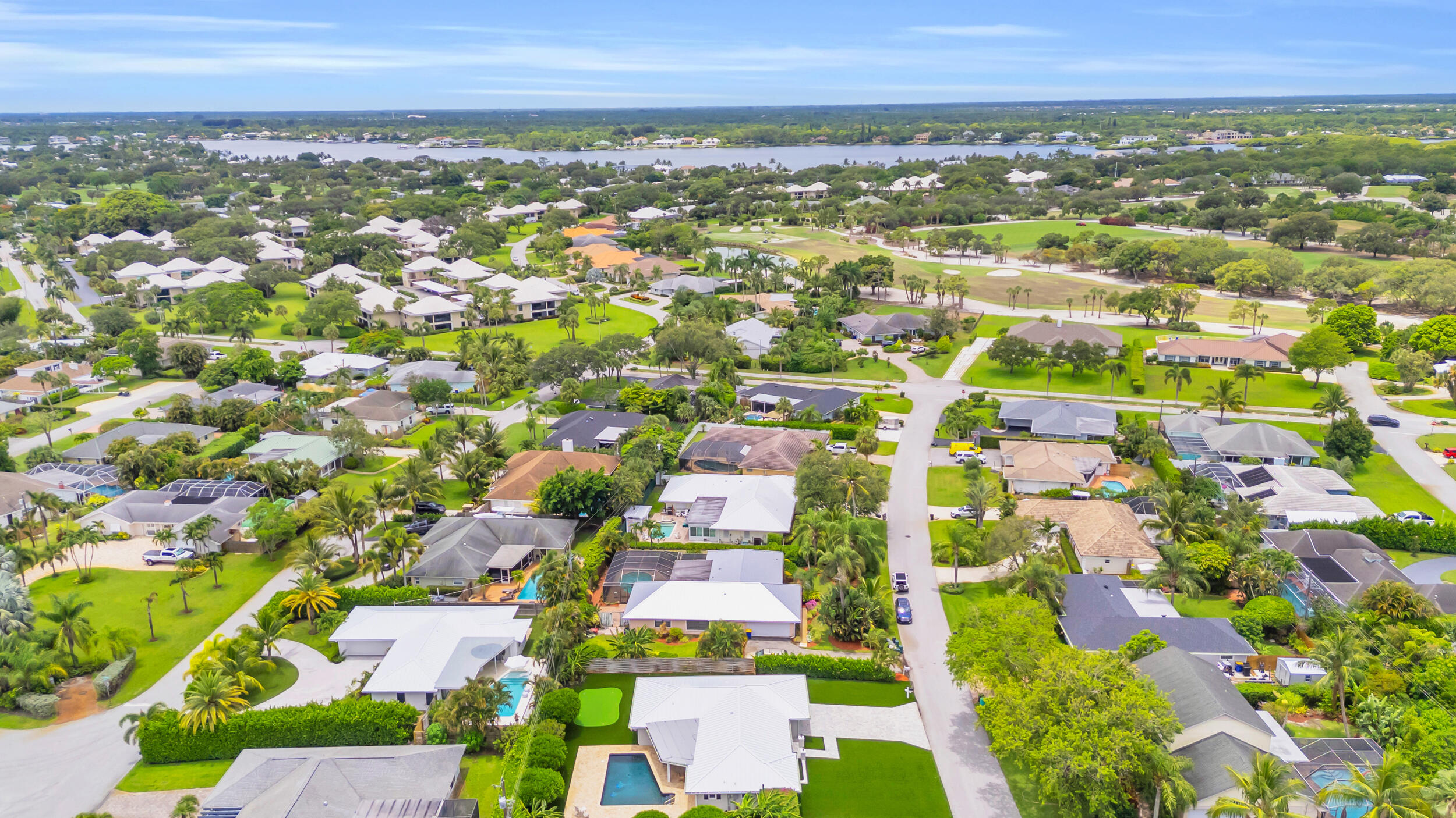11 Southeast Splitrail Circle Jupiter, FL 33469 - Photo 46 of 48 an aerial view of residential building with outdoor space and trees